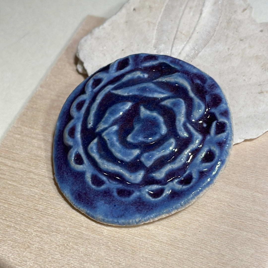 embossed flower brooch